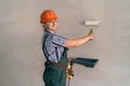 Woman in protective uniform with painting tools Royalty Free Stock Photo