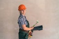 Woman in protective uniform with painting tools Royalty Free Stock Photo