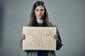 Woman, protest and poster for vaccination, flu shot or health and safety against gray studio background. Portrait of Royalty Free Stock Photo