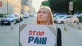 Woman protesting to stop pain by holding steamer