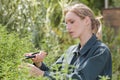 woman pruning scissors outdoors