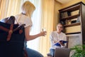 Woman psychologist working with teen girl in office. Royalty Free Stock Photo