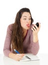 Woman pulling face at mobile phone