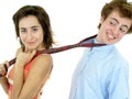 Woman pulling on man's tie