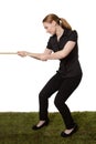 Woman pulling a rope tug of war Royalty Free Stock Photo