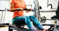 Woman pulling on row machine in fitness Royalty Free Stock Photo