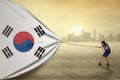 Woman pulling a south korean flag Royalty Free Stock Photo