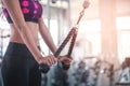 Woman pulling weight to train her arm and shoulder muscles in fitness gym Royalty Free Stock Photo