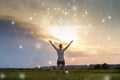 Woman pulls her hands to the sun on the background of a symbol of psychology