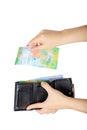 The woman pulls out a Swiss francs from her purse Royalty Free Stock Photo