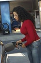 Woman Pumping Gas Into Car Royalty Free Stock Photo