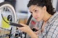 woman pumping up tire tyre with bike pump