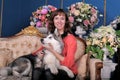 Woman with a puppy Malamute