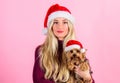 Woman with puppy wear santa hat. Celebrate christmas with pets. Reasons to love christmas with pets. Ways to have merry