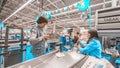 A woman with purchased products is at the cashier`s desk in the supermarket. Royalty Free Stock Photo