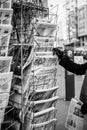 Woman purchases a le canard enchaine, l`alsace,la croiz, charlie