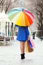 Woman with purchases and umbrella at street Royalty Free Stock Photo