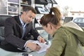 Woman purchasing the car form car dealer