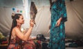 woman purifying the space with a ceremonial feather fan. Royalty Free Stock Photo