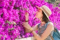 Woman at the purple blooming flowers at spring time Royalty Free Stock Photo