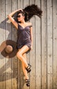 Woman in purple dress on wooden deck Royalty Free Stock Photo