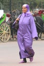 Woman dressed in purple hijab