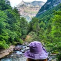 Woman purple& x27;s hat enjoying the pyrenees landscapes