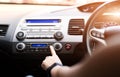Woman push turn on air conditioner in car Royalty Free Stock Photo