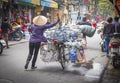 Woman Pushing Bicycle With Wares, Vietnam