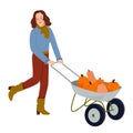 Woman pushing wheelbarrow with autumn harvest. Farm worker going with garden cart with pumpkins harvest. Farmer and