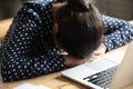 Woman put head on hands feels tired after long workday Royalty Free Stock Photo