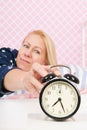 Woman put out the alarm clock Royalty Free Stock Photo