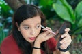 Woman puts on her face powder brush Royalty Free Stock Photo