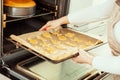 Woman puts the homemade cookies Royalty Free Stock Photo