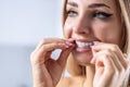 A woman puts on an invisible silicone teeth aligner. Dental braces for teeth correction Royalty Free Stock Photo