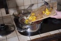 a woman puts paprika in the pan, ingredients for cooking borsch soup