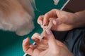 woman puts a plaster on her finger. Royalty Free Stock Photo