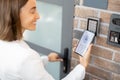 Opening door with a smart phone and keyboard on the wall