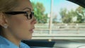 Woman puts on and takes off glasses while driving, blurred vision, asthenopia