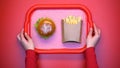Woman putting cafe tray with french fries and burger, unhealthy snack, top view