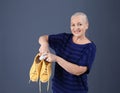 Woman putting capsule shoe freshener in footwear Royalty Free Stock Photo