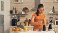 Putting coffee beans in grinder Royalty Free Stock Photo