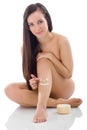Woman putting cream on her legs Royalty Free Stock Photo