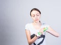 Woman Putting Liquid Facial Cleanser on a Cotton