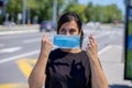 woman putting mask on her face Royalty Free Stock Photo