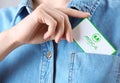 Woman putting medical business card into pocket. Nephrology service