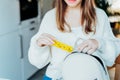 Woman putting daily pills organizer into her bag. Taking daily medicine antioxidant diet vitamin supplements for beauty Royalty Free Stock Photo