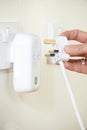 Woman Putting Plug Into Smart Electricity Socket Royalty Free Stock Photo