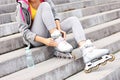 Woman putting on roller-blades Royalty Free Stock Photo