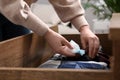 Woman putting scented sachet into drawer with clothes, closeup Royalty Free Stock Photo